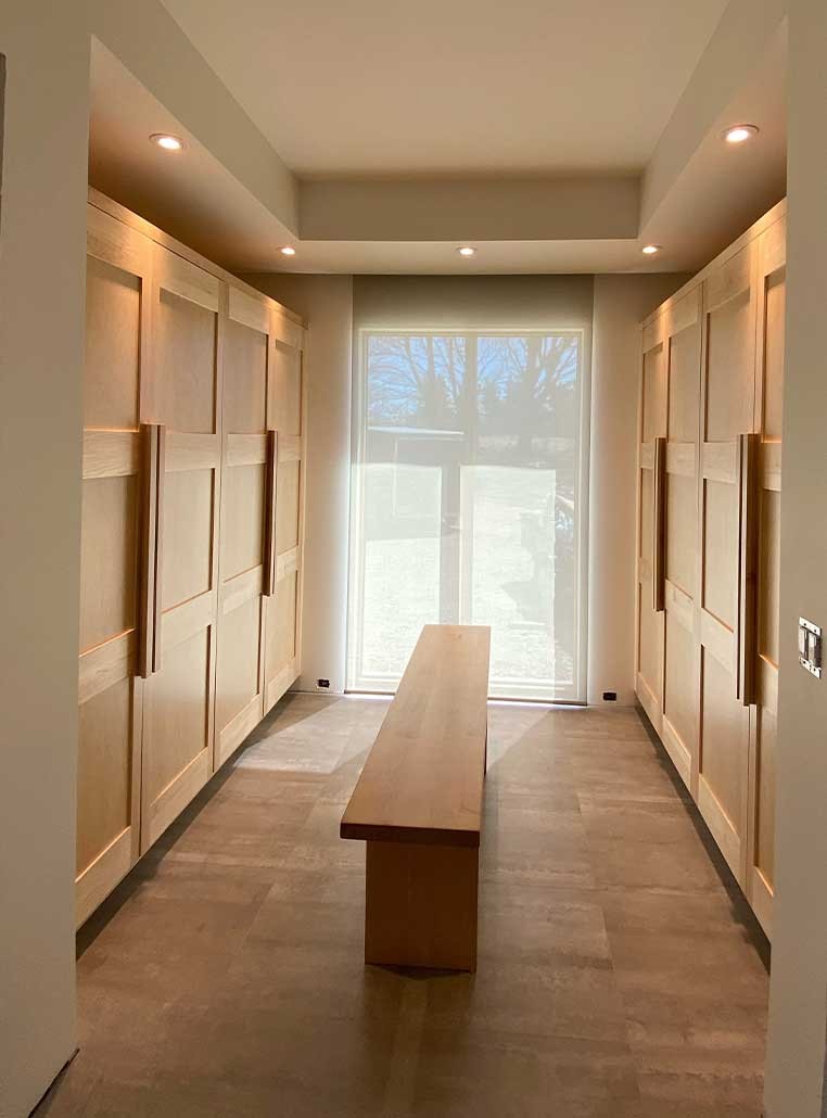 Closet with a window and bench